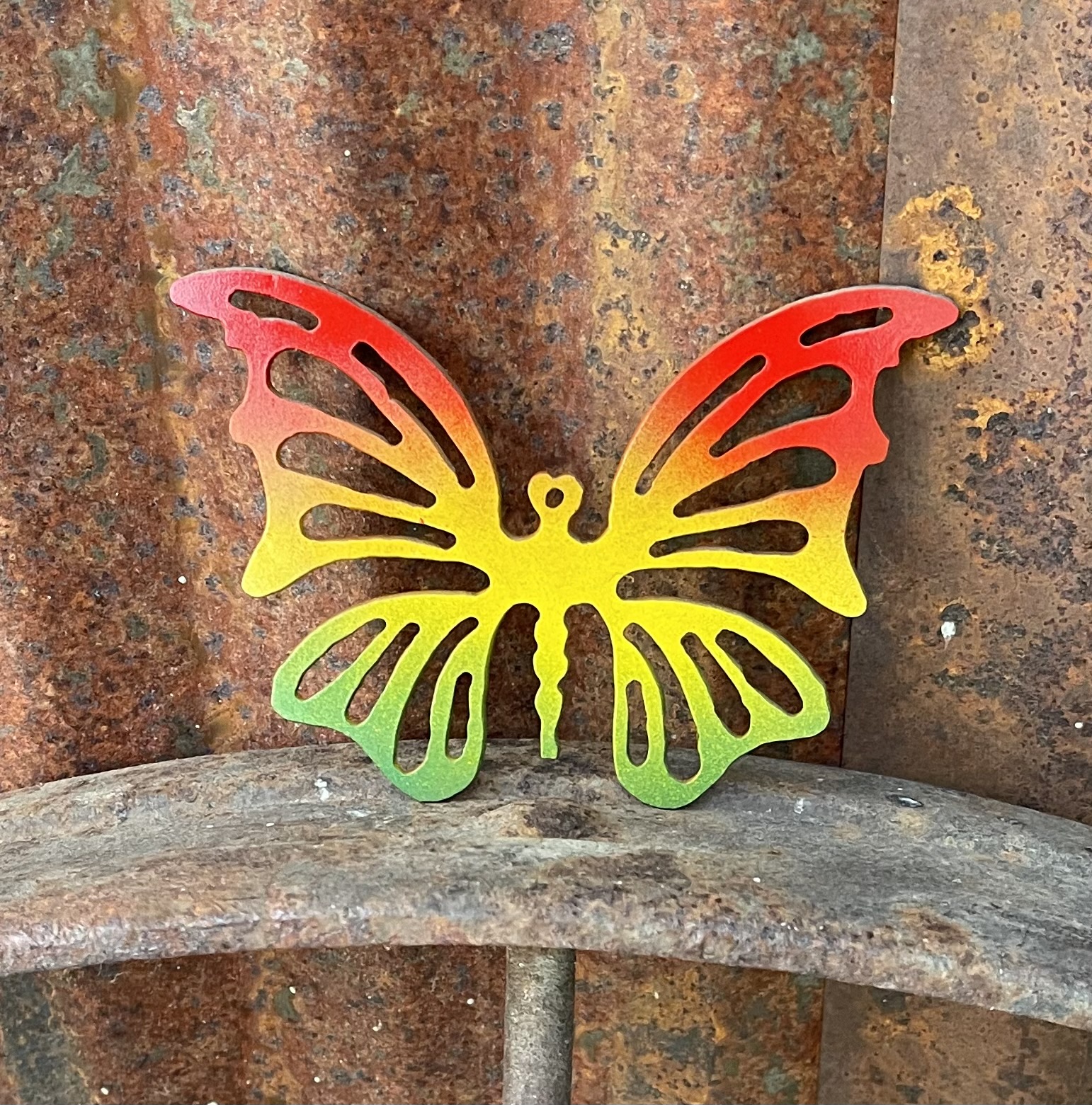 Butterfly – small, painted red, orange, and green